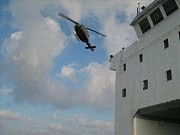 Над судном вертолет мальтийской службы спасения